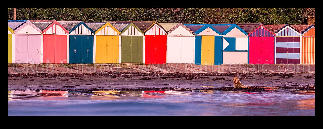 Image of Titahi Bay Beach boat sheds, a colourful brightly painted iconic feature of the bay. Panorama, Titahi Bay, Porirua City District, Wellington Region, New Zealand (NZ) stock photo image