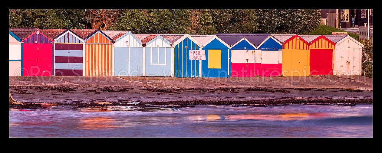 Image of Titahi Bay Beach boat sheds, a colourful brightly painted iconic feature of the bay. Panorama, Titahi Bay, Porirua City District, Wellington Region, New Zealand (NZ) stock photo image