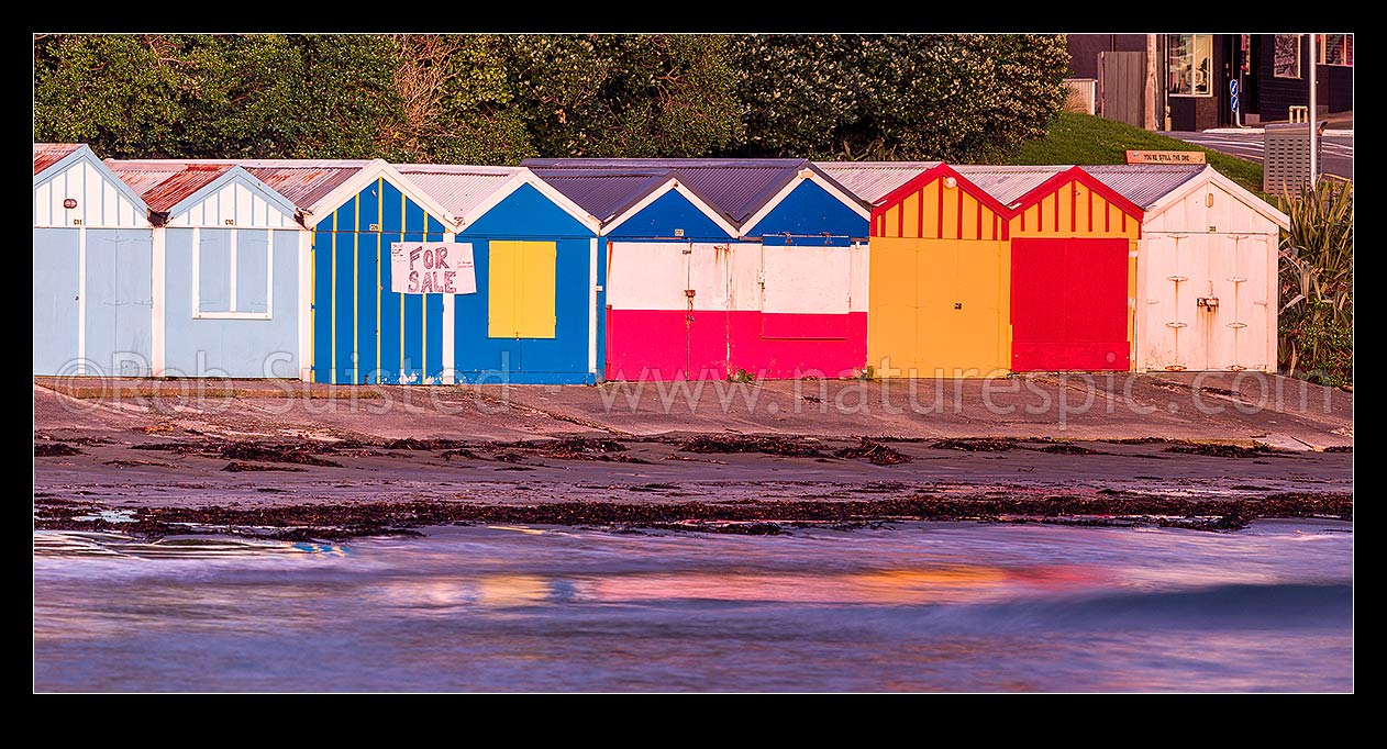 Image of Titahi Bay Beach boat sheds, a colourful brightly painted iconic feature of the bay. Panorama, Titahi Bay, Porirua City District, Wellington Region, New Zealand (NZ) stock photo image