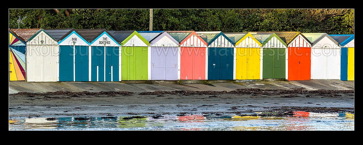 Image of Titahi Bay Beach boat sheds, a colourful brightly painted iconic feature of the bay. Panorama, Titahi Bay, Porirua City District, Wellington Region, New Zealand (NZ) stock photo image