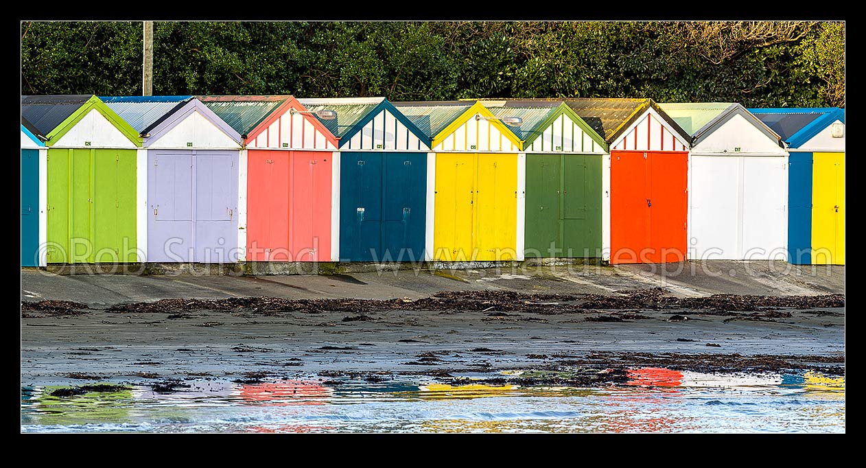 Image of Titahi Bay Beach boat sheds, a colourful brightly painted iconic feature of the bay. Panorama, Titahi Bay, Porirua City District, Wellington Region, New Zealand (NZ) stock photo image