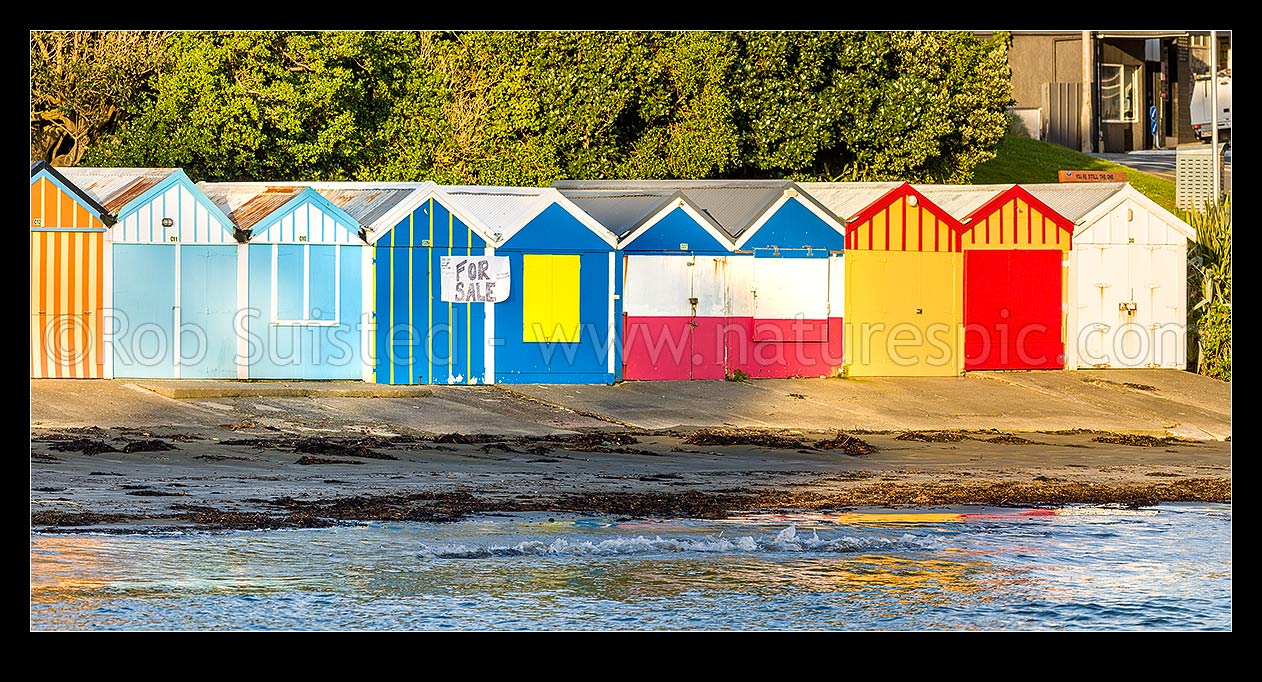 Image of Titahi Bay Beach boat sheds, a colourful brightly painted iconic feature of the bay. Panorama, Titahi Bay, Porirua City District, Wellington Region, New Zealand (NZ) stock photo image