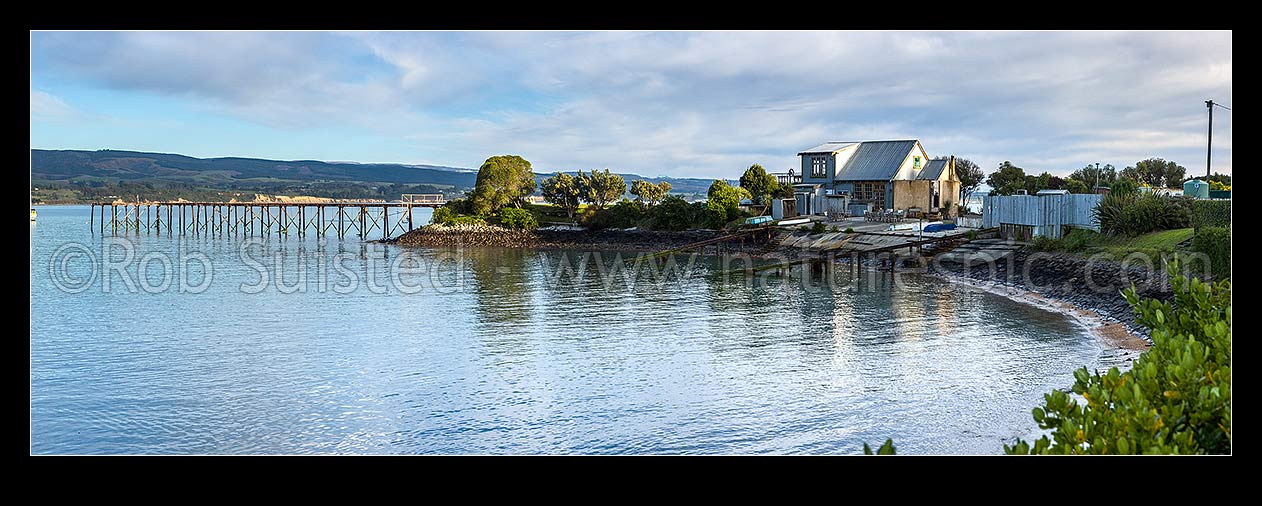 Image of Onekakara Bay at Moeraki with old commercial wharf. Panorama, Moeraki, Waitaki District, Canterbury Region, New Zealand (NZ) stock photo image