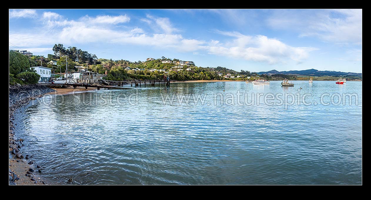 Image of Moeraki fishing fleet vessels moored in Onekakara Bay on a calm morning. Panorama, Moeraki, Waitaki District, Canterbury Region, New Zealand (NZ) stock photo image