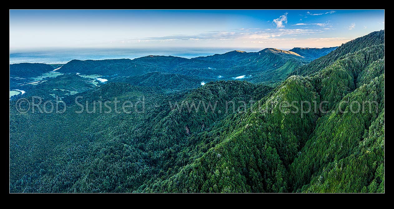 Image of Forested view over Mumm Creek (centre), Karamea Bluffs (distant right), with Podge Creek and Radiant Range foothills (right). Mokihinui River mouth, town, Summerlea  far left. Aerial panorama, Mokihinui, Buller District, West Coast Region, New Zealand (NZ) stock photo image