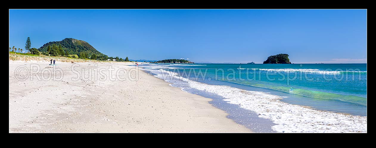 Image of Papamoa Beach on a summer day, looking west towards Mt Maunganui Mauao and Motuotau Island (right). Panorama, Papamoa Beach, Tauranga District, Bay of Plenty Region, New Zealand (NZ) stock photo image