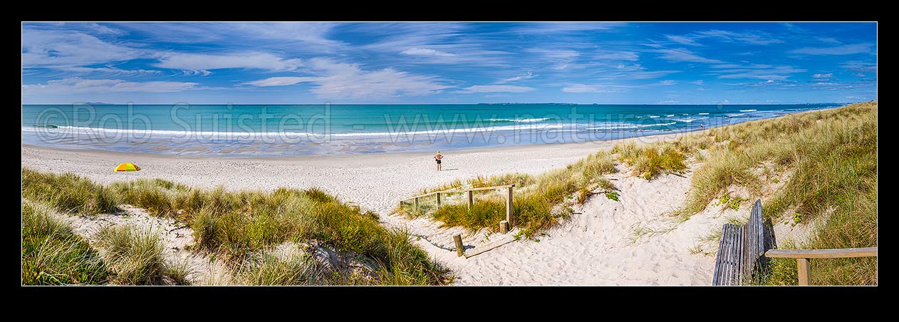 Image of Papamoa Beach. Looking over the white sand beach and sand dune access path on a sunny blue sky day towards Motiti Island. Panorama, Papamoa Beach, Tauranga District, Bay of Plenty Region, New Zealand (NZ) stock photo image