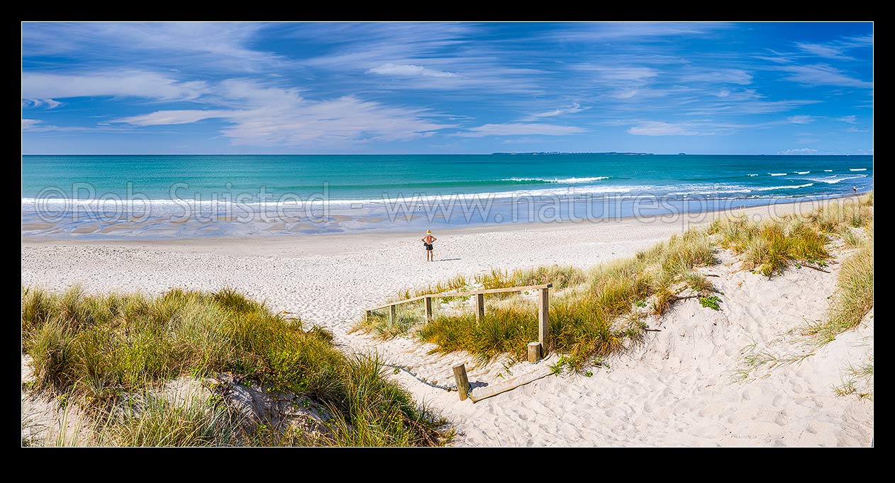 Image of Papamoa Beach. Looking over the white sand beach and sand dune access path on a sunny blue sky day towards Motiti Island. Panorama, Papamoa Beach, Tauranga District, Bay of Plenty Region, New Zealand (NZ) stock photo image