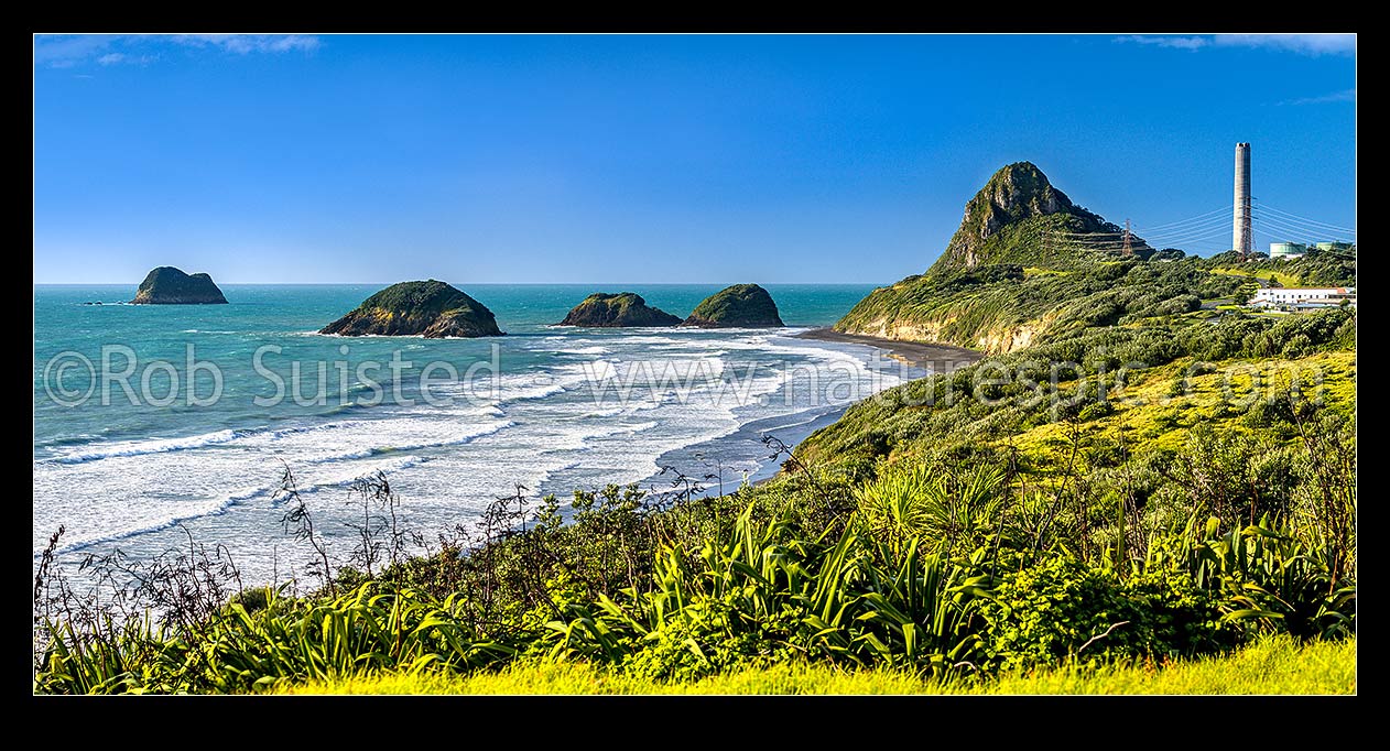 Image of Nga Motu Sugar Loaf Islands, Paritutu Rock (154m) and distinctive power station chimney landmark behind. Nga Motu Taranaki. Flax foreground. Panorama, New Plymouth, New Plymouth District, Taranaki Region, New Zealand (NZ) stock photo image