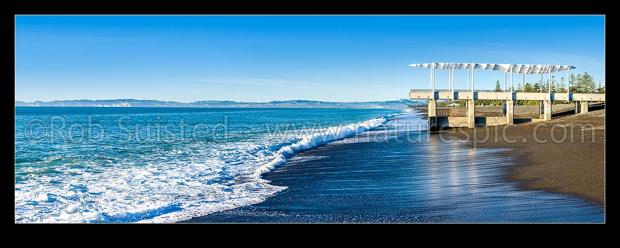 Image of Napier foreshore with viewing platform and marine outfall in early morning light. Clifton and Cape Kidnappers coast beyond. Panorama, Napier, Napier City District, Hawke's Bay Region, New Zealand (NZ) stock photo image