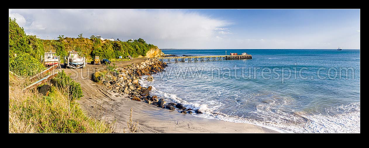 Image of Owenga Wharf at Owenga. Panorama showing commercial fishing vessels and boats onshore, Chatham Islands Rekohu, Chatham Islands District, Chatham Islands Region, New Zealand (NZ) stock photo image