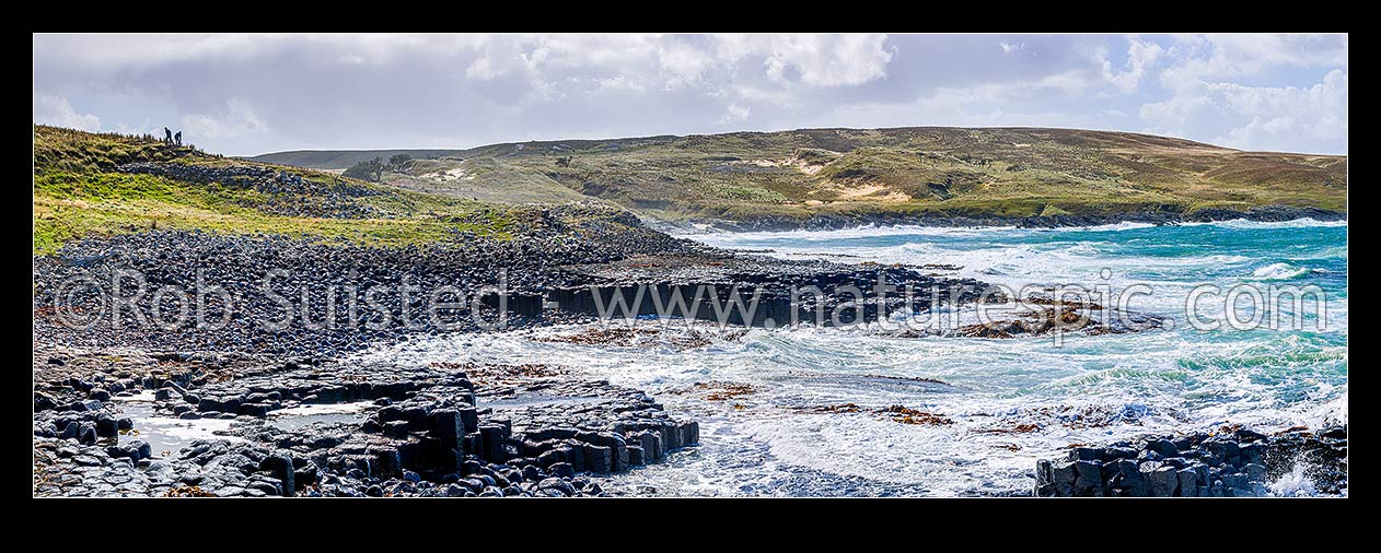 Image of Ohira Bay basalt columns in Petre Bay, with visitors visiting on a typically windy day on Rekohu. Panorama view, Chatham Islands Rekohu, Chatham Islands District, Chatham Islands Region, New Zealand (NZ) stock photo image