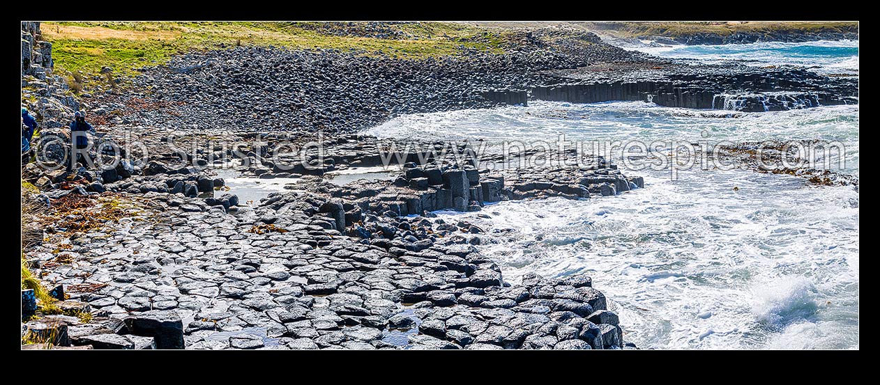 Image of Ohira Bay basalt columns in Petre Bay, with visitors visiting on a typically windy day on Rekohu. Panorama view, Chatham Islands Rekohu, Chatham Islands District, Chatham Islands Region, New Zealand (NZ) stock photo image