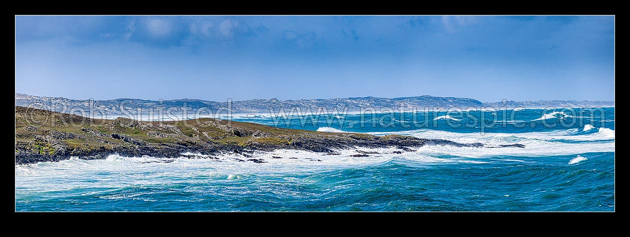 Image of Chatham Islands coast, looking from Ohira Bay, across Petrie Bay to Long Beach and sand dunes, on blustery windy day. Panorama, Chatham Islands Rekohu, Chatham Islands District, Chatham Islands Region, New Zealand (NZ) stock photo image