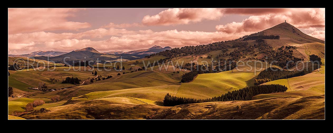 Image of North Otago farmland at Goodwood with Puketapu Hill (344m) right with Sir John McKenzie Monument. Panorama. Similar to 39924 with different light, Palmerston, Waitaki District, Canterbury Region, New Zealand (NZ) stock photo image